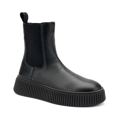 Frau - Beatles donna in pelle nera.