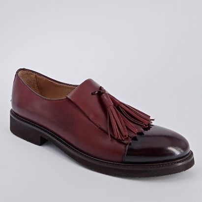 CALPIERRE  Scarpa accollata con frangia e nappine . -30%