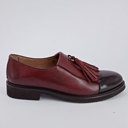 CALPIERRE  Scarpa accollata con frangia e nappine . -30%
