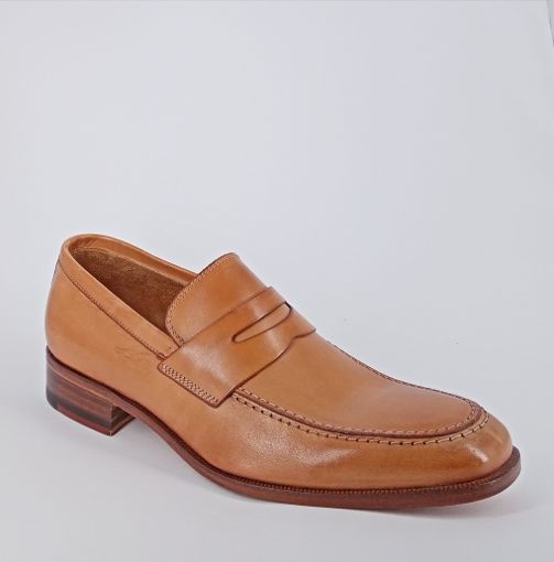 CALPIERRE . Mocassino in pelle cognac .